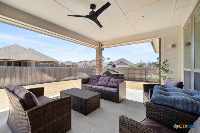 view of patio featuring a ceiling fan, a fenced backyard, and outdoor lounge area