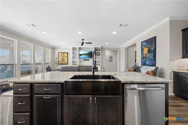 kitchen featuring dishwasher, ornamental molding, open floor plan, and visible vents