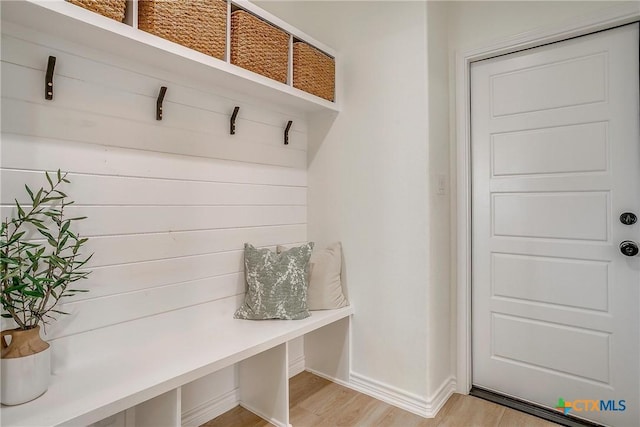 mudroom with light hardwood / wood-style floors