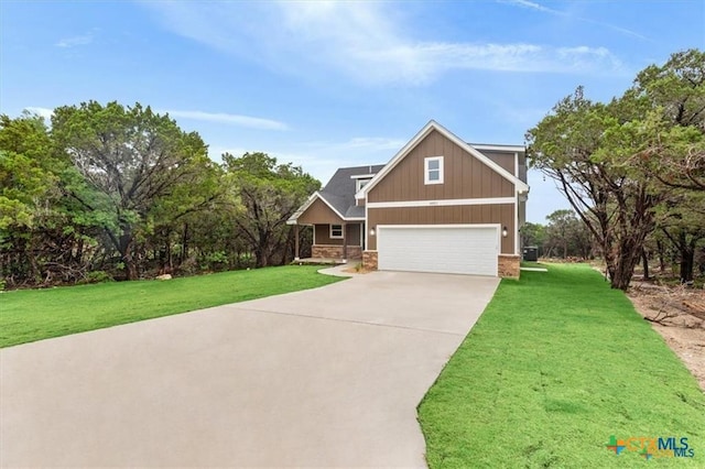 craftsman-style home with a garage and a front lawn