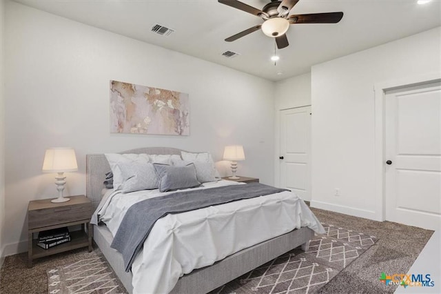 bedroom featuring ceiling fan and dark carpet