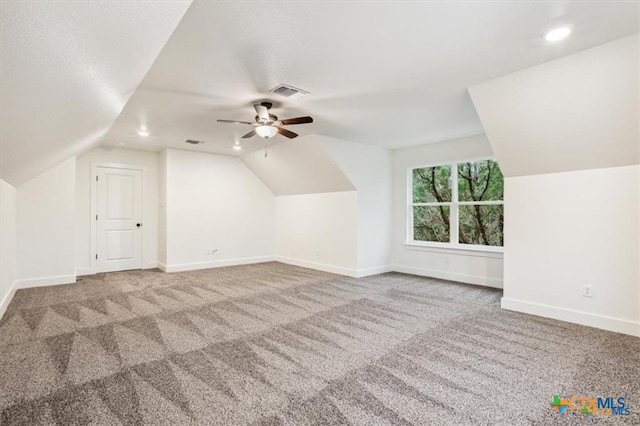 bonus room featuring carpet floors, vaulted ceiling, and ceiling fan