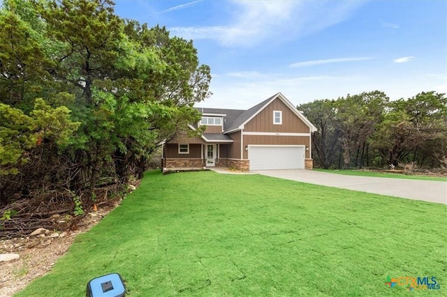 craftsman-style home featuring a garage and a front yard