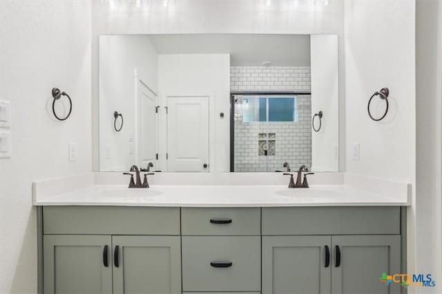 bathroom featuring vanity and a shower with shower door