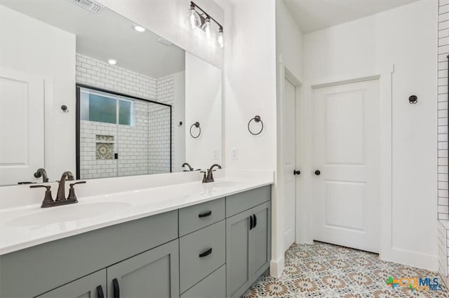 bathroom with vanity and an enclosed shower