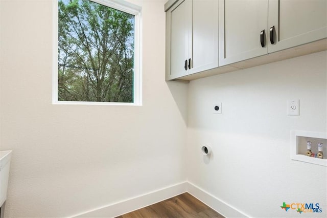 laundry area with washer hookup, dark hardwood / wood-style flooring, cabinets, and hookup for an electric dryer