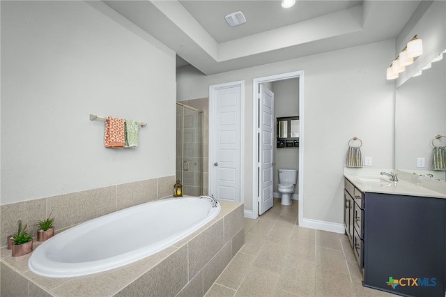 full bathroom with vanity, baseboards, toilet, a shower stall, and a bath