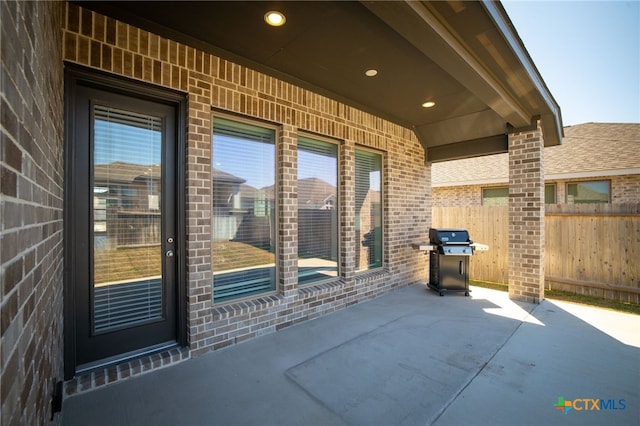 view of patio / terrace featuring fence and grilling area