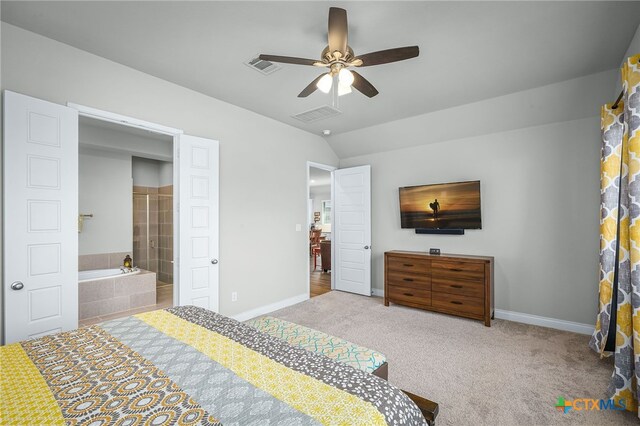 carpeted bedroom with vaulted ceiling, baseboards, and visible vents