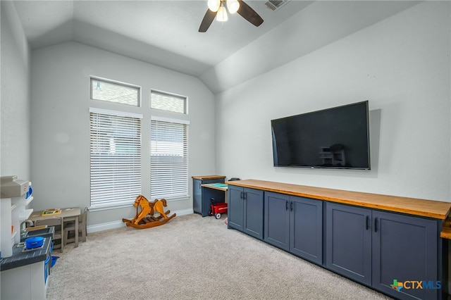 game room featuring carpet flooring, visible vents, a ceiling fan, and vaulted ceiling