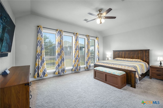 carpeted bedroom with lofted ceiling and a ceiling fan