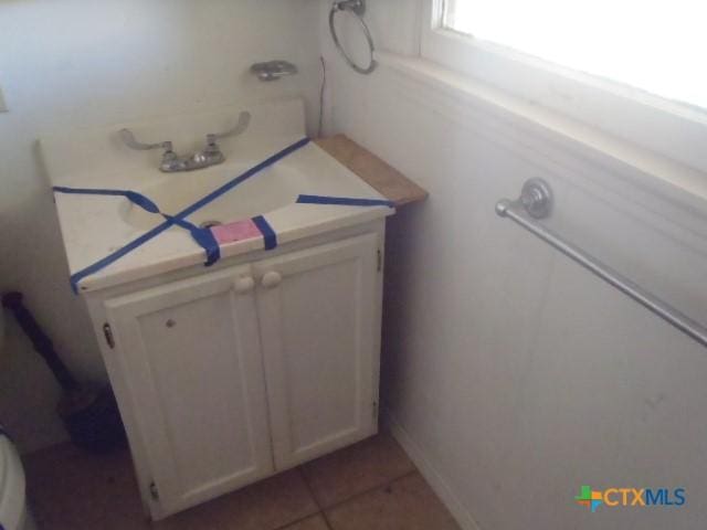 bathroom with vanity and tile patterned floors