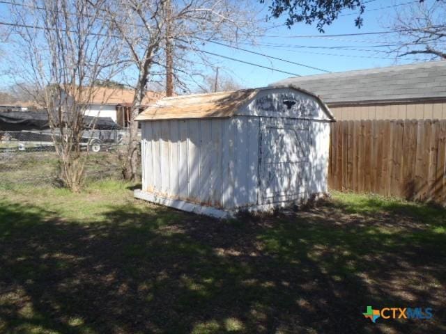 view of shed with fence