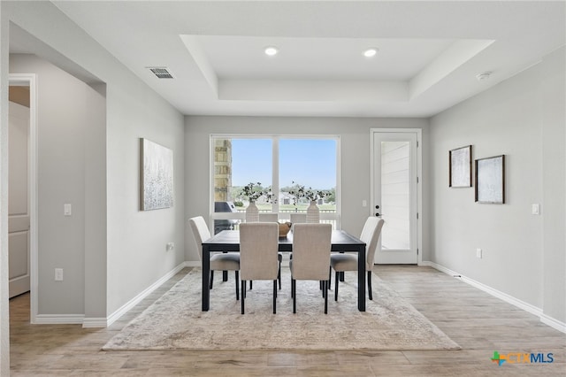117 Ace Ln Unit 101, San Marcos, TX 78666 - dining room with a raised ceiling, light wood-type flooring, and recessed lighting