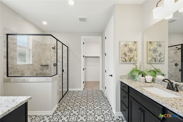 117 Ace Ln Unit 101, San Marcos, TX 78666 - full bath featuring vanity, a stall shower, a walk in closet, and recessed lighting