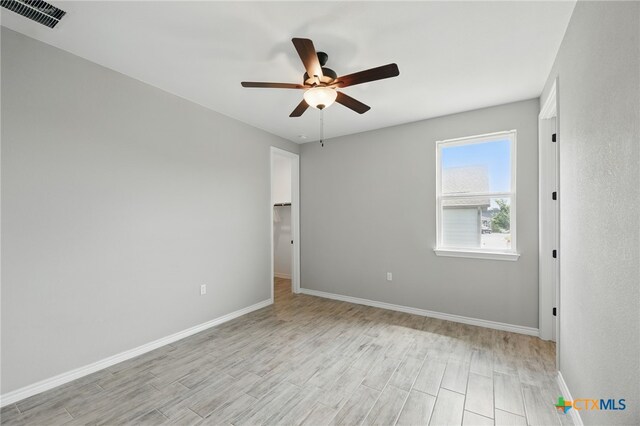 117 Ace Ln Unit 101, San Marcos, TX 78666 - empty room featuring a ceiling fan and light wood-type flooring