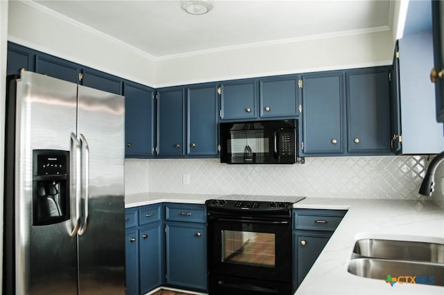 211 Alamogordo Dr, Victoria, TX 77904 - kitchen featuring black appliances, light countertops, blue cabinets, backsplash, and crown molding