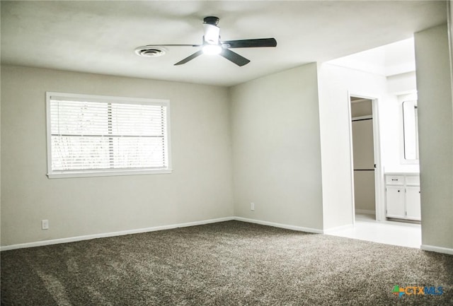 211 Alamogordo Dr, Victoria, TX 77904 - unfurnished bedroom featuring carpet flooring, connected bathroom, and a ceiling fan