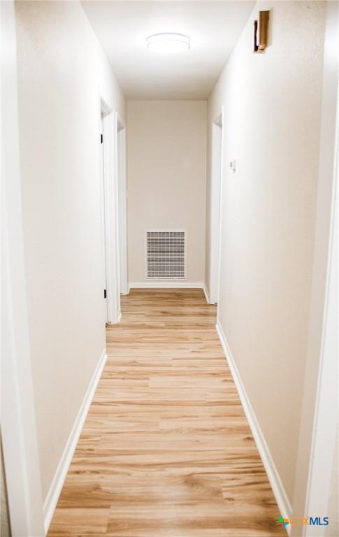 211 Alamogordo Dr, Victoria, TX 77904 - hall featuring light wood-style floors and baseboards