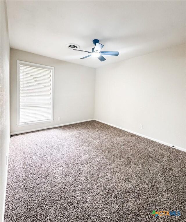 211 Alamogordo Dr, Victoria, TX 77904 - carpeted empty room with ceiling fan and baseboards