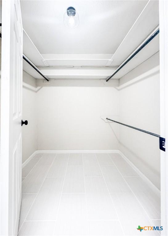211 Alamogordo Dr, Victoria, TX 77904 - walk in closet featuring light tile patterned floors