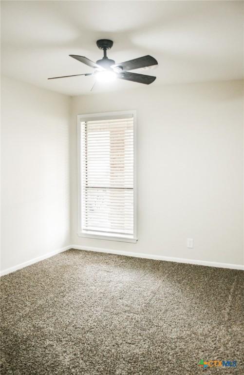 211 Alamogordo Dr, Victoria, TX 77904 - carpeted spare room with ceiling fan and baseboards