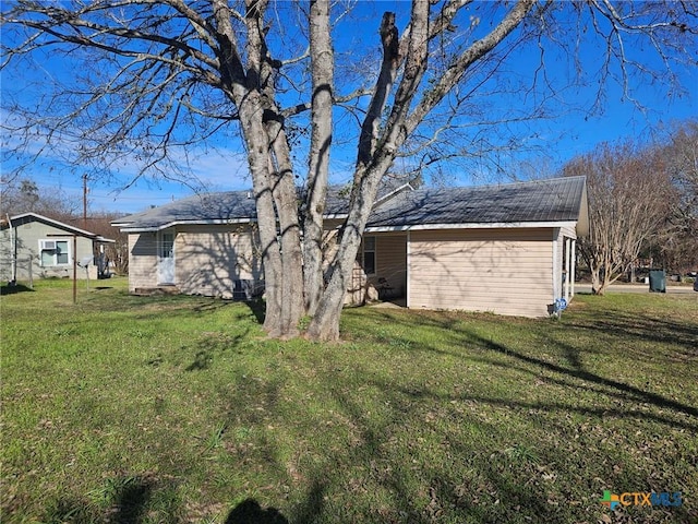 view of property exterior with a yard