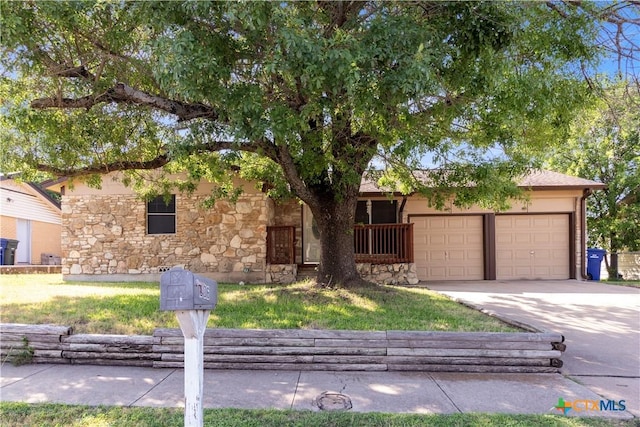 806 S 23rd St, Copperas Cove, TX 76522 - view of front facade featuring stone siding, a garage, and concrete driveway