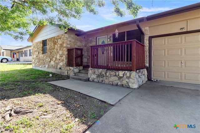 806 S 23rd St, Copperas Cove, TX 76522 - ranch-style house with stone siding, a garage, and concrete driveway