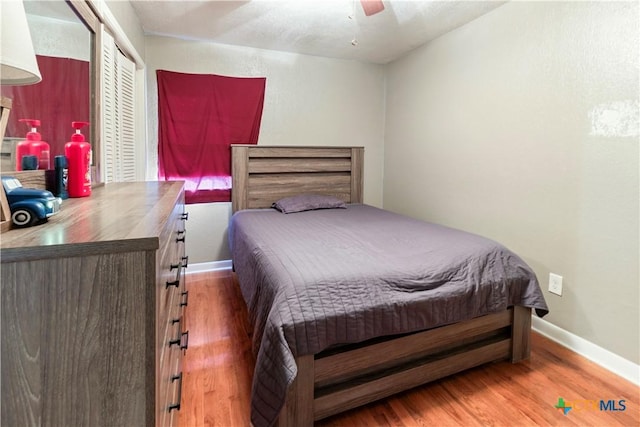 806 S 23rd St, Copperas Cove, TX 76522 - bedroom with wood finished floors, baseboards, a closet, and a ceiling fan