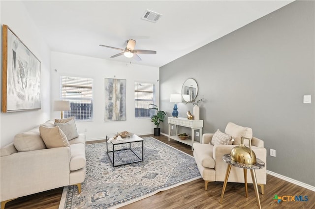 living room featuring ceiling fan and hardwood / wood-style flooring