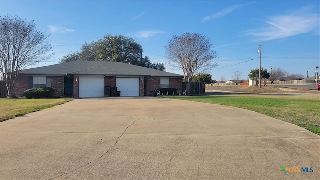 view of front of home featuring a garage and a front yard