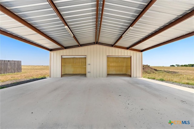 garage featuring a rural view