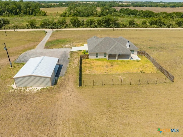 birds eye view of property with a rural view