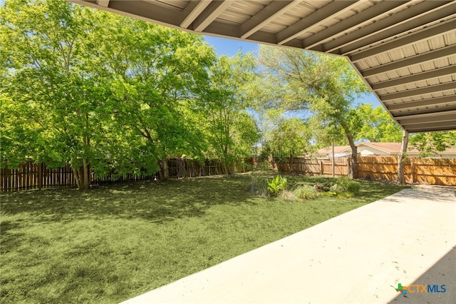 105 Schroeder St, Lockhart, TX 78644 - view of yard with a fenced backyard and a patio
