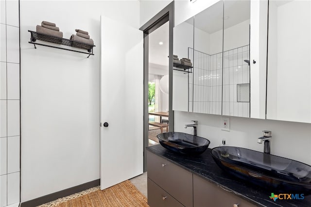 105 Schroeder St, Lockhart, TX 78644 - bathroom featuring a sink and double vanity