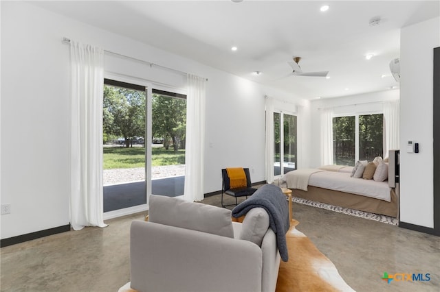 105 Schroeder St, Lockhart, TX 78644 - bedroom with a ceiling fan, finished concrete floors, baseboards, access to exterior, and recessed lighting