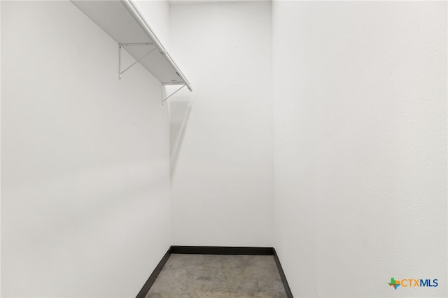 105 Schroeder St, Lockhart, TX 78644 - spacious closet featuring carpet flooring