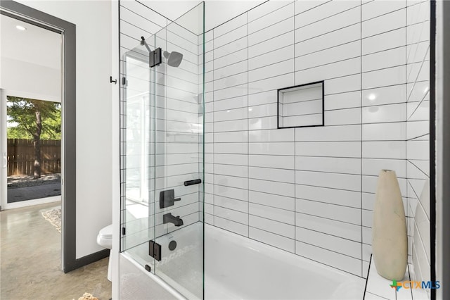 105 Schroeder St, Lockhart, TX 78644 - bathroom featuring concrete floors, toilet, and enclosed tub / shower combo