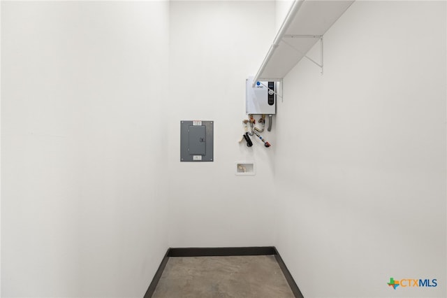 105 Schroeder St, Lockhart, TX 78644 - clothes washing area featuring baseboards, hookup for a washing machine, laundry area, and electric panel