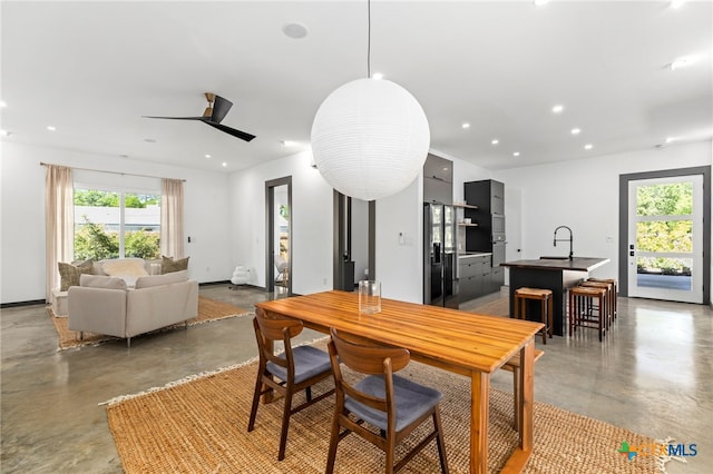 105 Schroeder St, Lockhart, TX 78644 - dining space featuring concrete floors, a ceiling fan, and recessed lighting