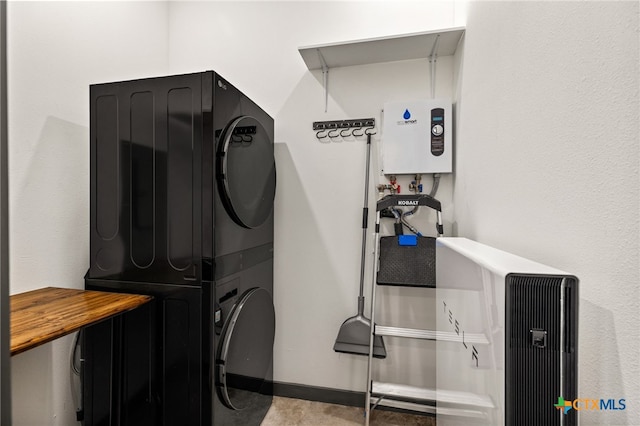 105 Schroeder St, Lockhart, TX 78644 - laundry room featuring stacked washer / drying machine, water heater, and laundry area