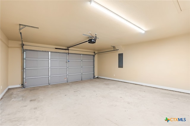 garage with electric panel and a garage door opener