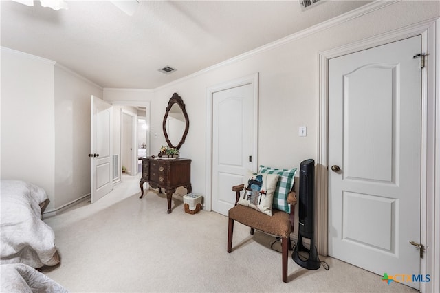 living area with light carpet, a textured ceiling, and ornamental molding