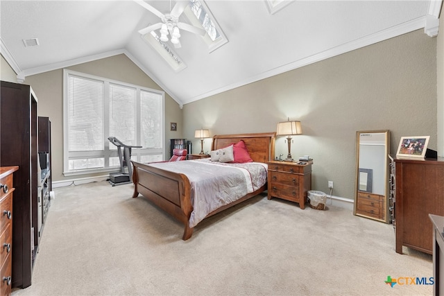 carpeted bedroom with vaulted ceiling, ceiling fan, and ornamental molding