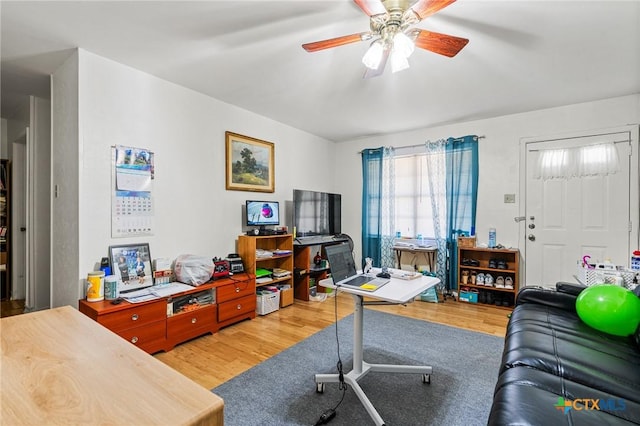 home office with ceiling fan and wood finished floors