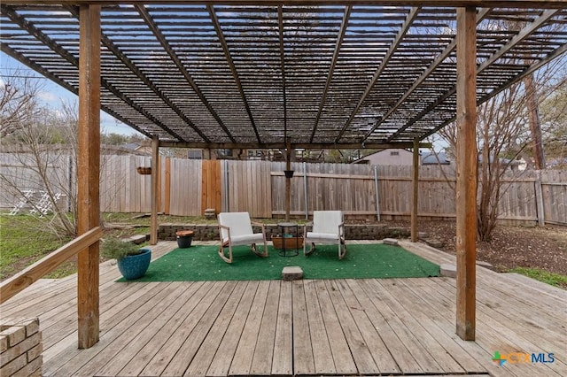 wooden deck featuring a fenced backyard and a pergola