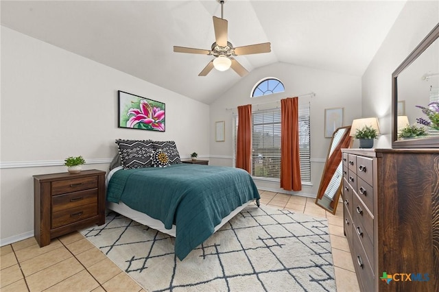 tiled bedroom featuring vaulted ceiling and ceiling fan