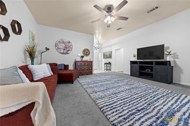 carpeted living room with vaulted ceiling and ceiling fan