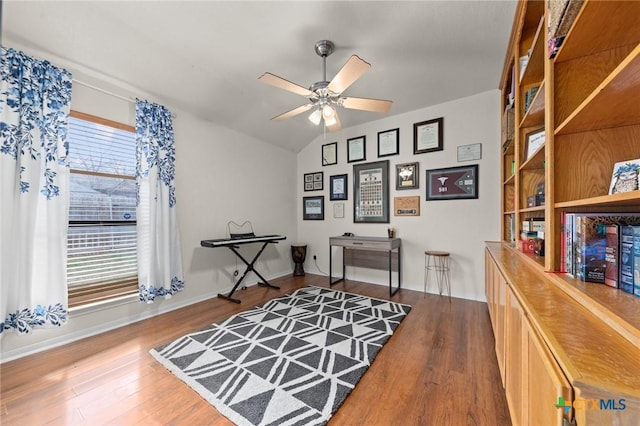 interior space featuring wood-type flooring, vaulted ceiling, and ceiling fan